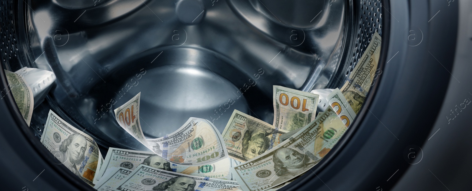 Image of Money laundering. Many dollar banknotes in washing machine, banner design