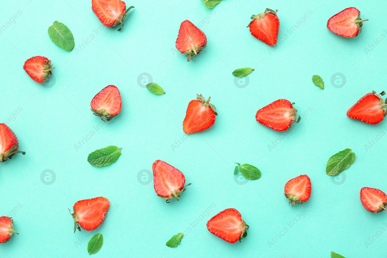 Photo of Flat lay composition with ripe red strawberries and mint on color background