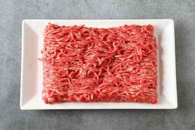 Photo of Raw ground meat on grey table, top view