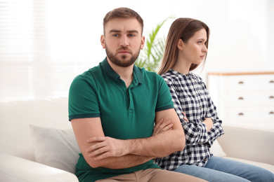 Stubborn man and woman with problems in relationship at home