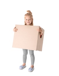 Photo of Cute little girl playing with cardboard box on white background