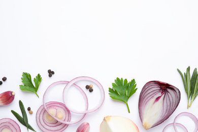 Flat lay composition with cut onion and spices on white background
