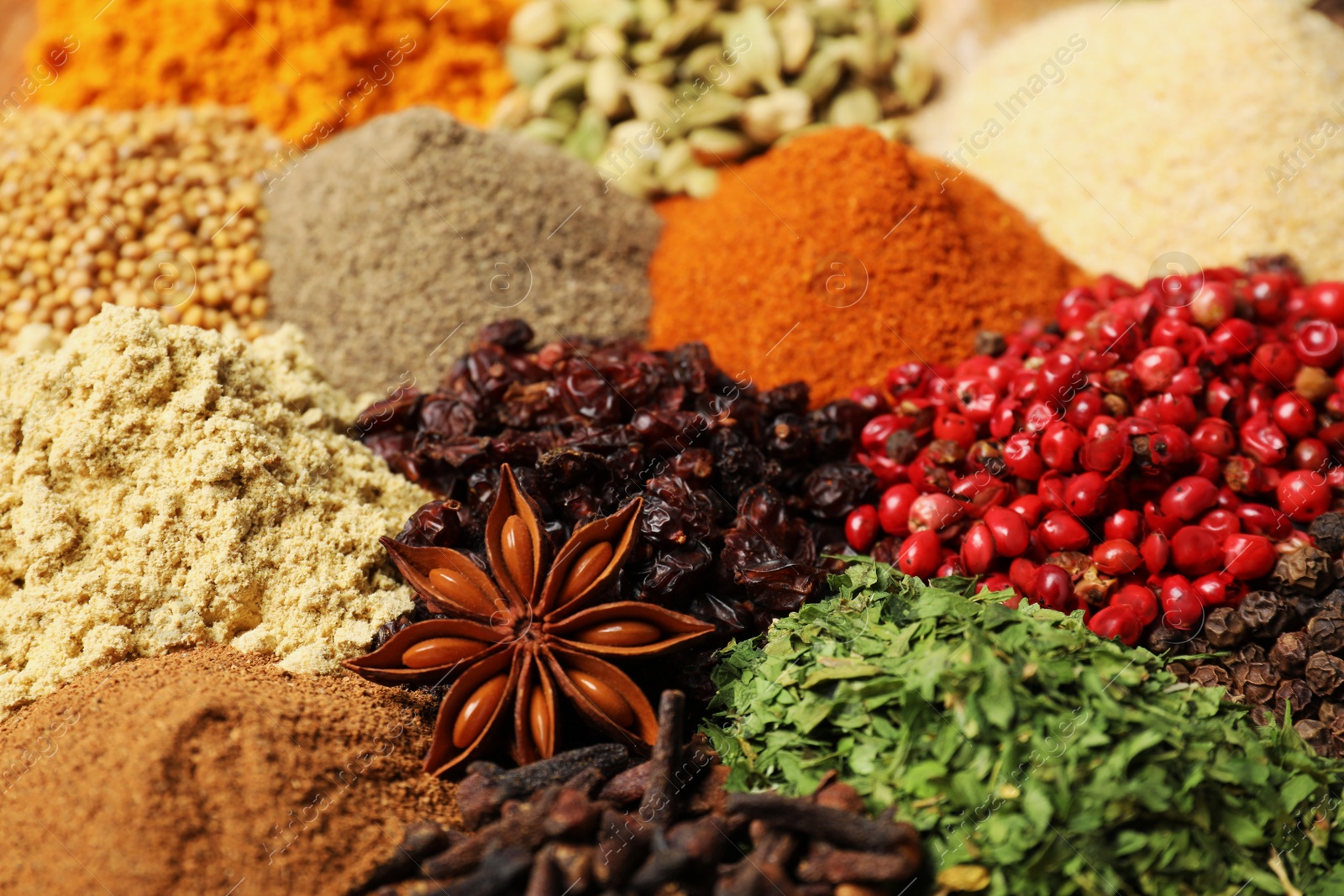 Photo of Many different spices as background, closeup view