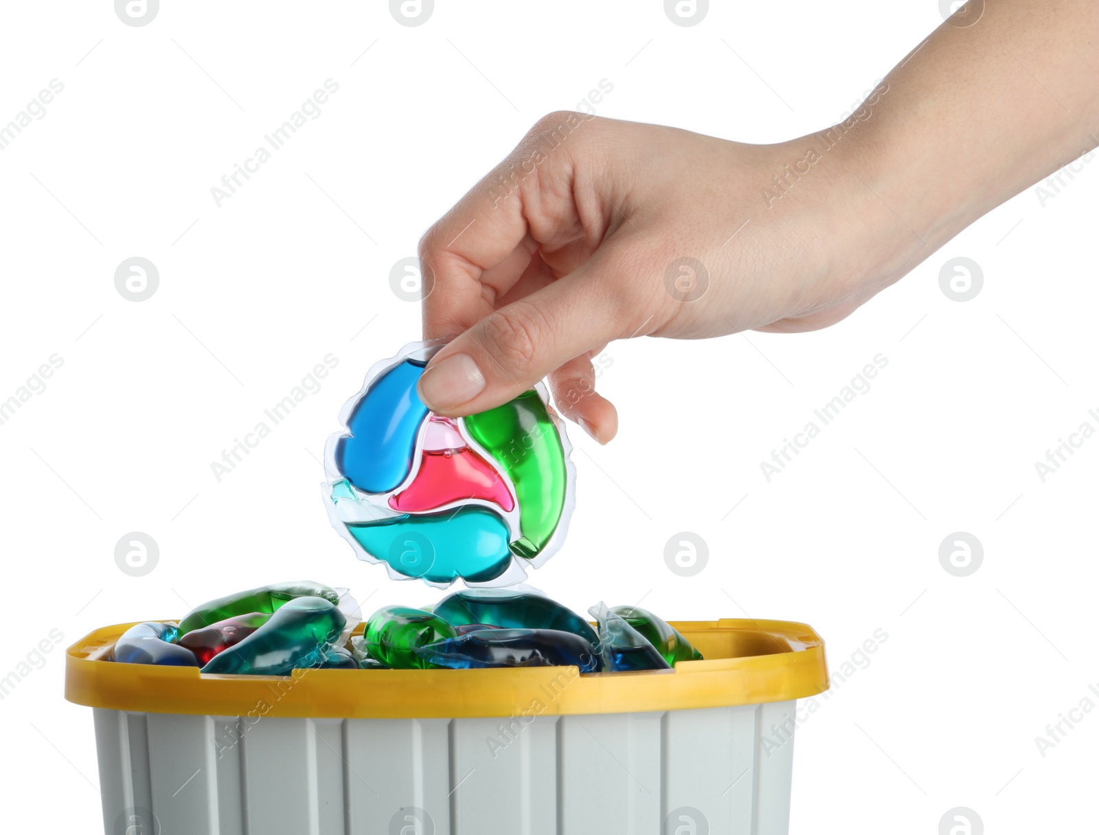 Photo of Woman taking laundry capsule out of box against white background, closeup