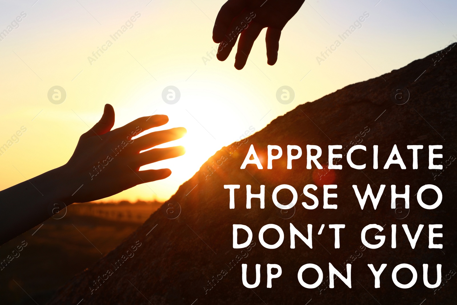 Image of Appreciate Those Who Don't Give Up On You. Inspirational quote reminding to be grateful for support from caring people. Text against view of hiker helping friend outdoors at sunset