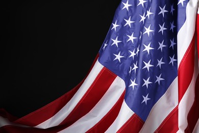 Photo of National flag of America on black background, space for text. Memorial day celebration