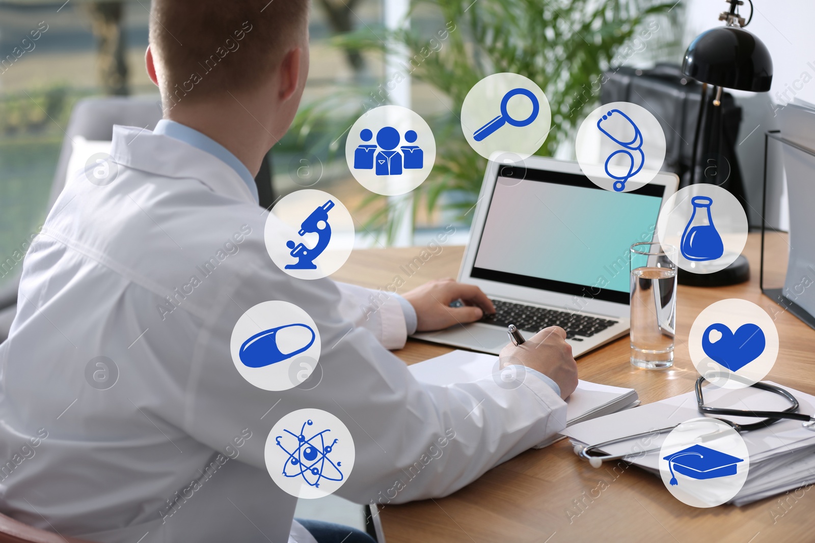 Image of Medical student working with laptop indoors, closeup