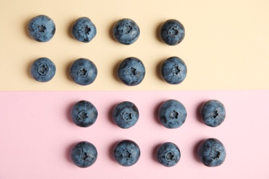 Flat lay composition with tasty blueberry on color background