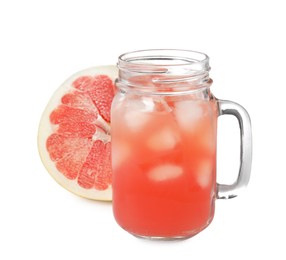 Photo of Glass jar of pink pomelo juice and fruit isolated on white