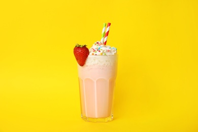 Photo of Glass of tasty milk shake on color background