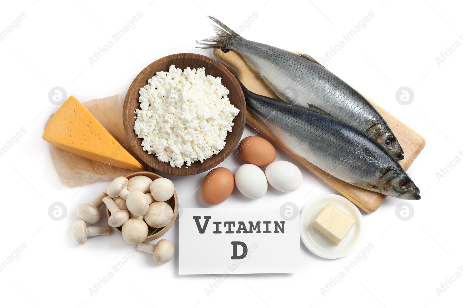 Photo of Paper with phrase VITAMIN D and fresh products on white background, top view