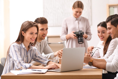 Team of professional journalists working in office