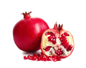 Photo of Ripe fresh pomegranate fruits on white background