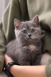 Photo of Owner with cute fluffy kitten, closeup view