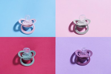 New baby pacifiers on color background, flat lay