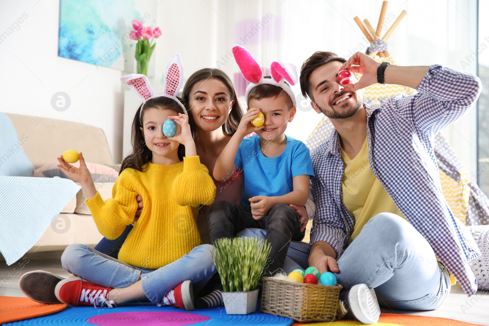 Photo of Happy family spending time together during Easter holiday at home