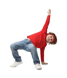 Happy little boy dancing on white background