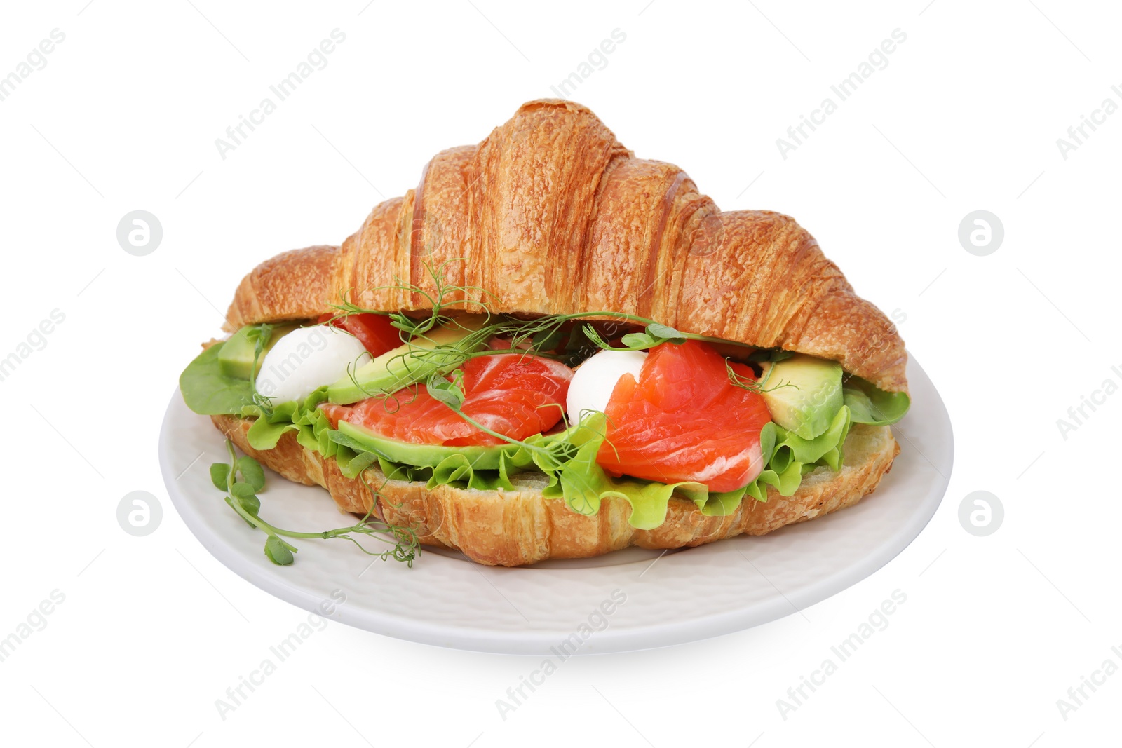 Photo of Tasty croissant with salmon, avocado, mozzarella and lettuce isolated on white