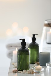 Photo of Soap dispensers and decor elements on table