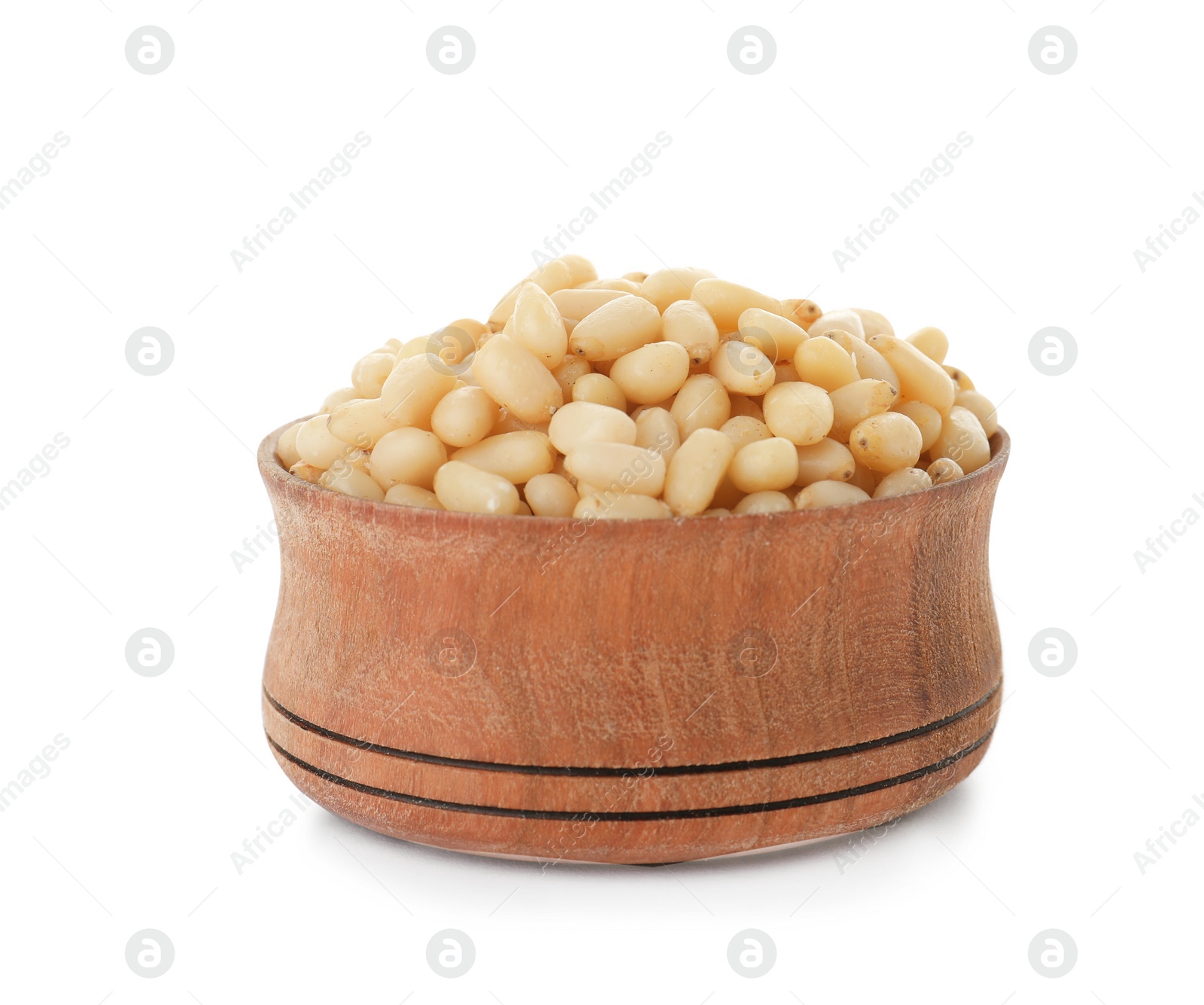 Photo of Bowl with pine nuts on white background