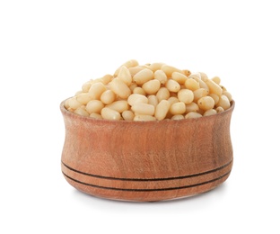 Photo of Bowl with pine nuts on white background