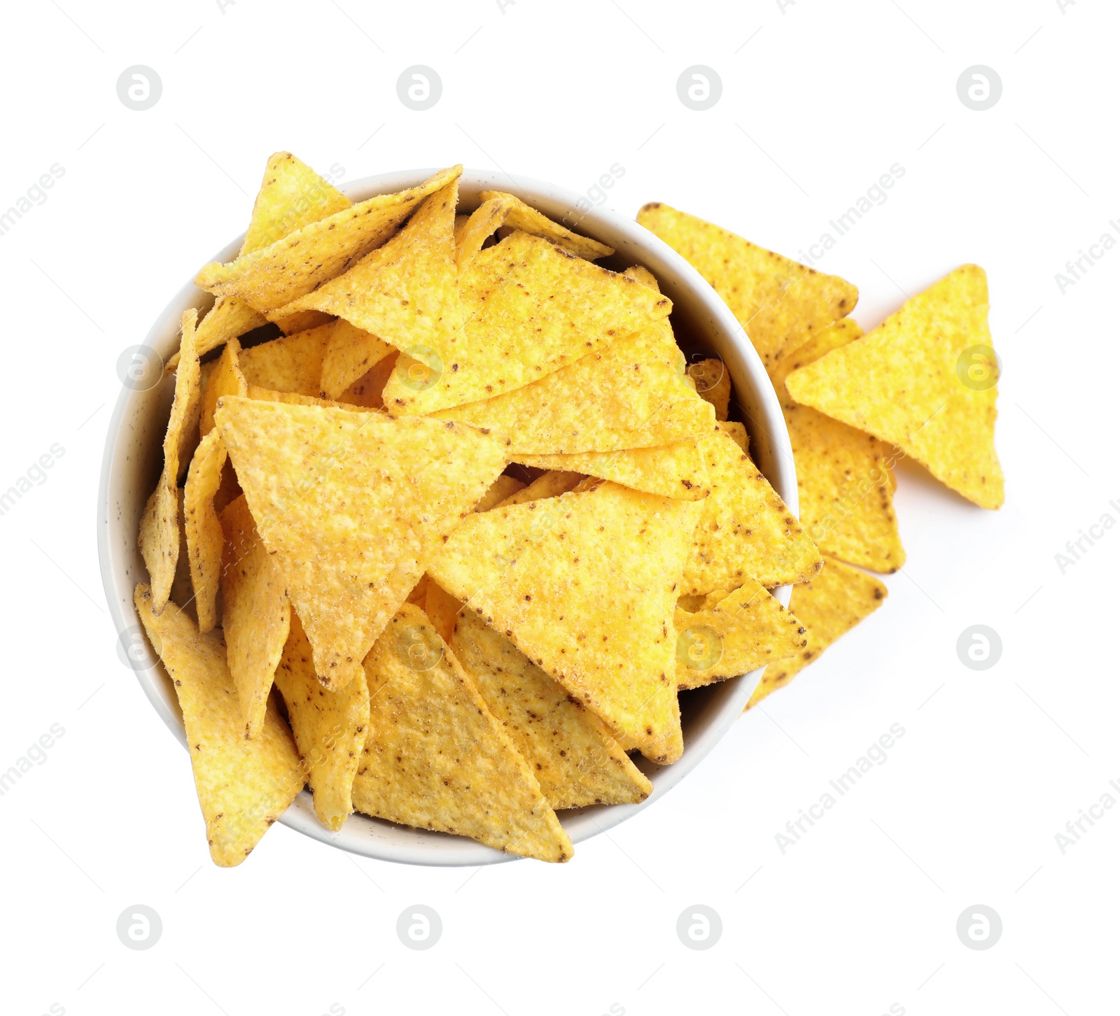 Photo of Bowl with tasty Mexican nachos chips on white background, top view