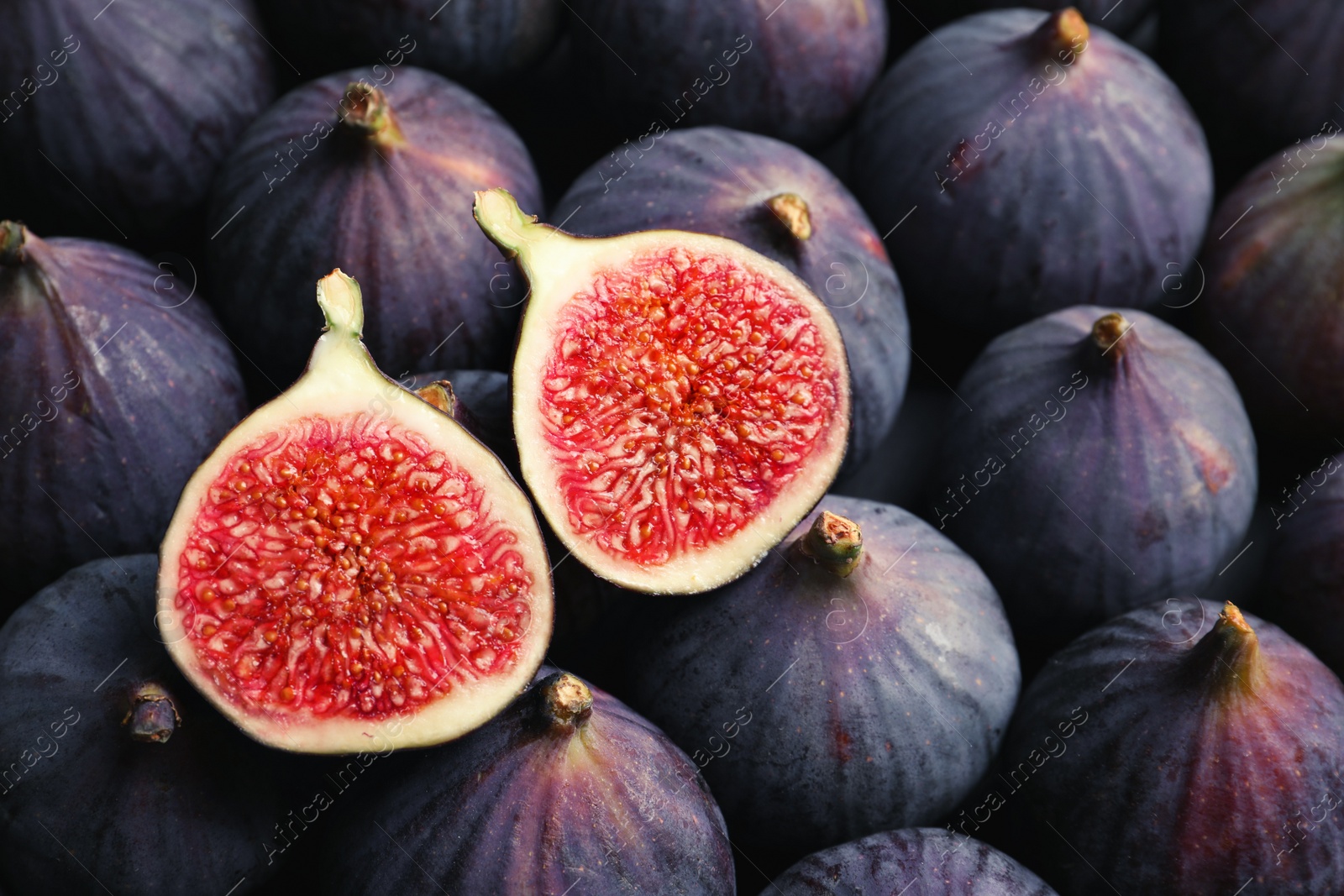 Photo of Fresh ripe figs as background, top view. Tropical fruit