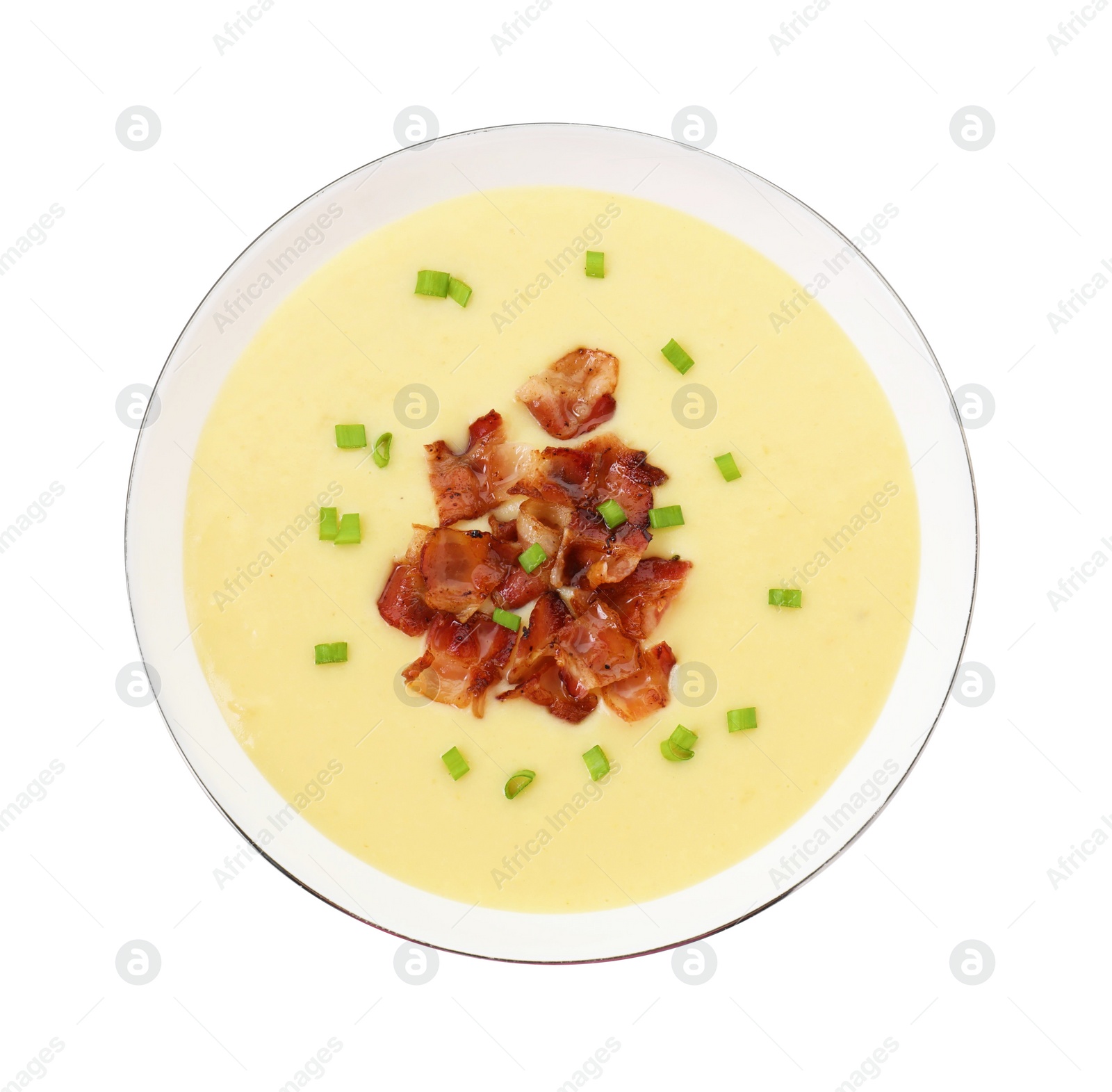 Photo of Tasty potato soup with bacon and green onion in bowl isolated on white, top view