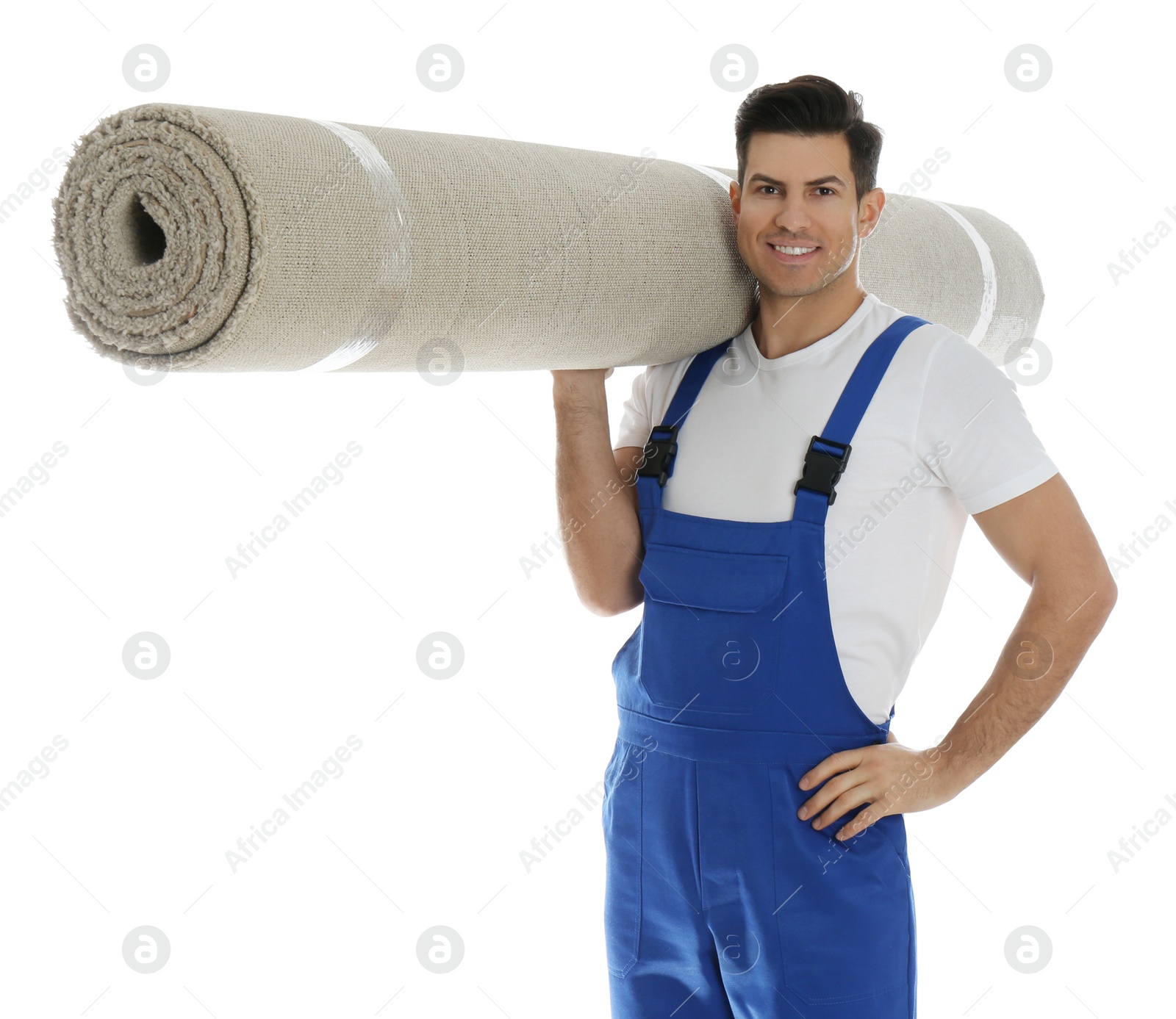 Photo of Male worker with rolled carpet on white background