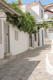 Photo of City street with beautiful buildings on sunny day