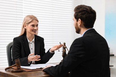 Man having meeting with lawyer in office