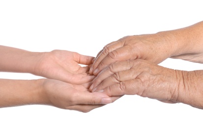 Photo of People holding hands together on white background. Help and elderly care service