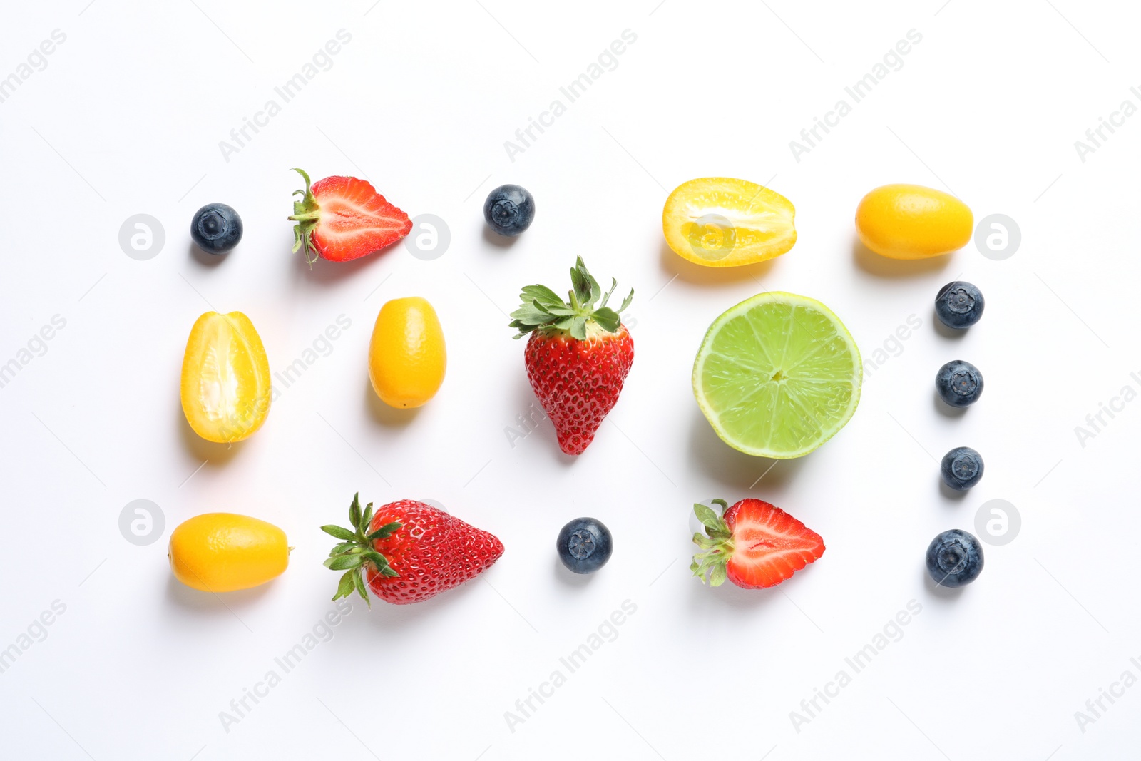 Photo of Fresh fruits and berries on white background, top view