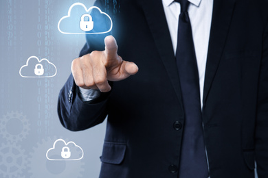 Image of Cyber security concept. Businessman touching cloud with padlock illustration, closeup