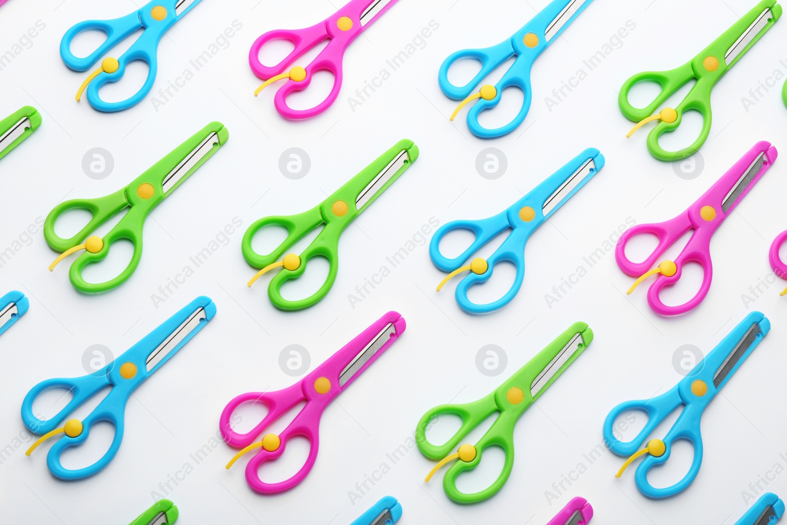 Photo of Set of training scissors on white background, top view