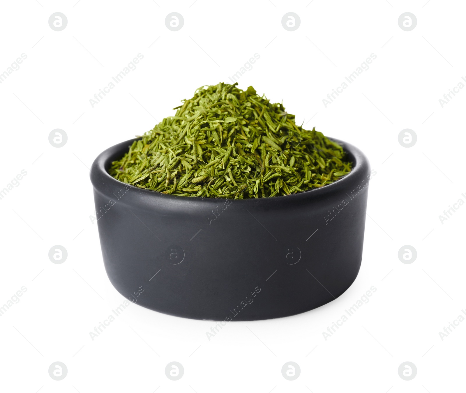 Photo of Bowl of dried thyme isolated on white