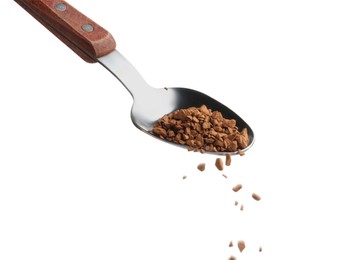 Photo of Pouring instant coffee from spoon on white background