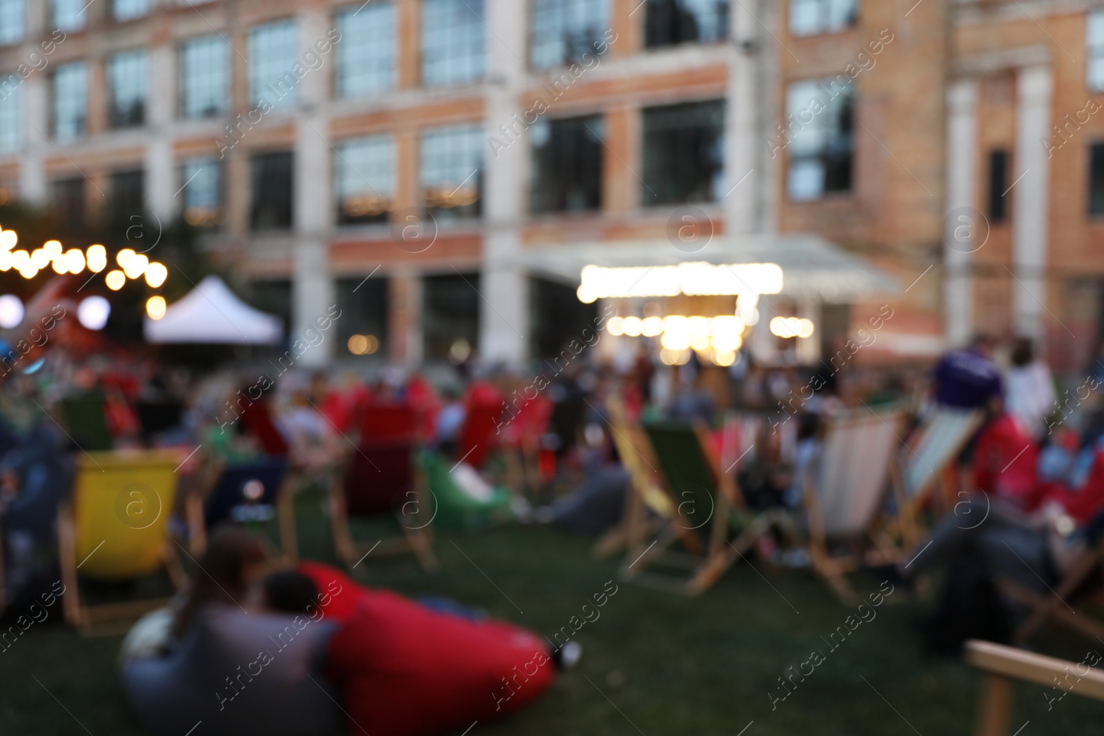 Photo of Blurred view of open air cinema. Bokeh effect