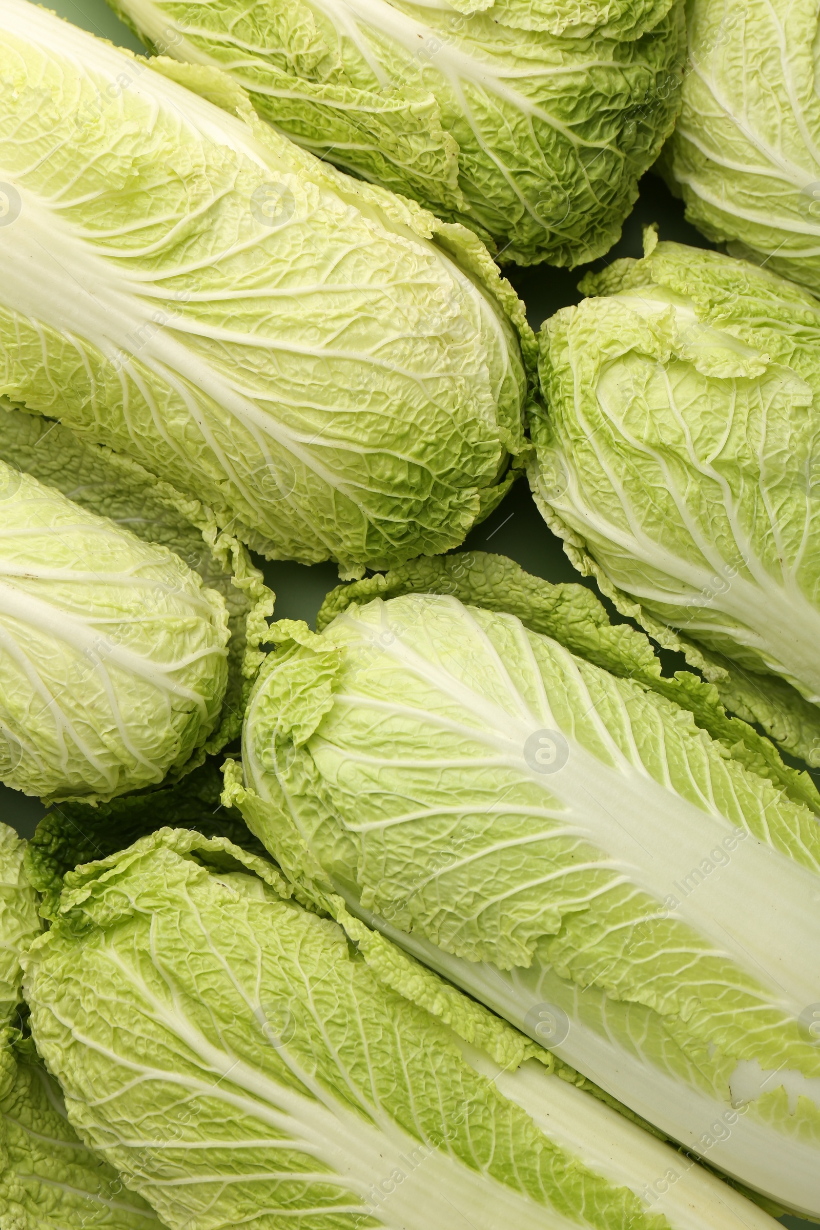 Photo of Fresh ripe Chinese cabbages as background, top view