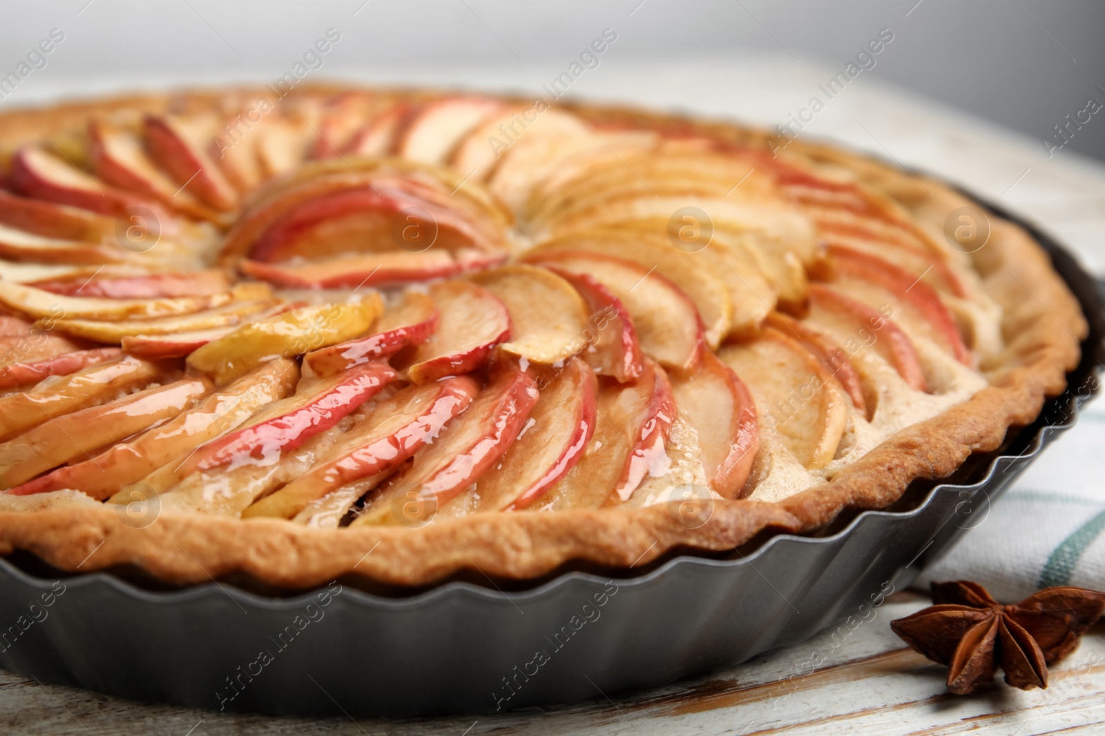 Photo of Delicious homemade apple tart on table, closeup