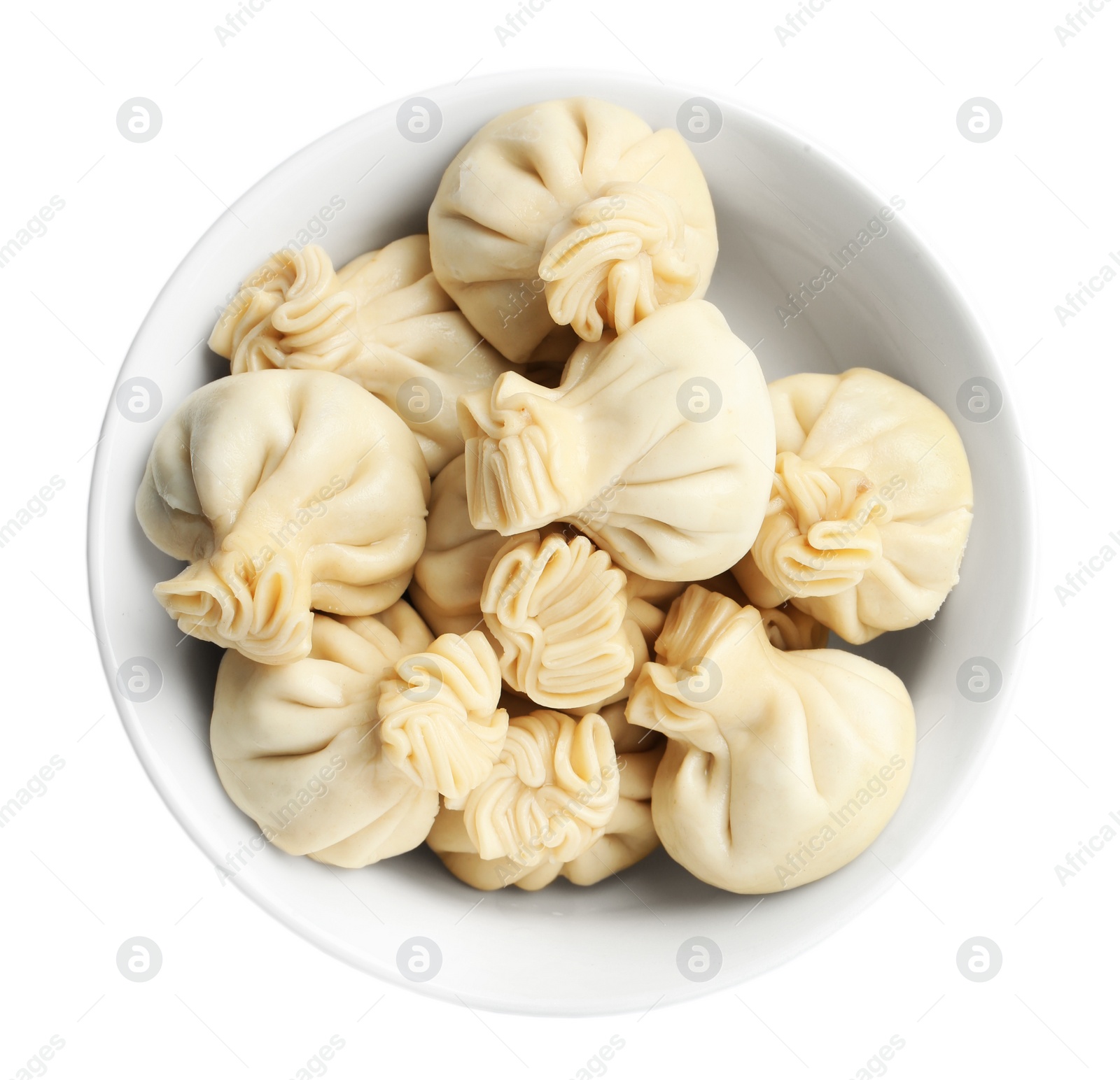 Photo of Bowl with tasty dumplings isolated on white, top view