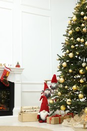 Living room interior with beautiful Christmas tree and festive decor