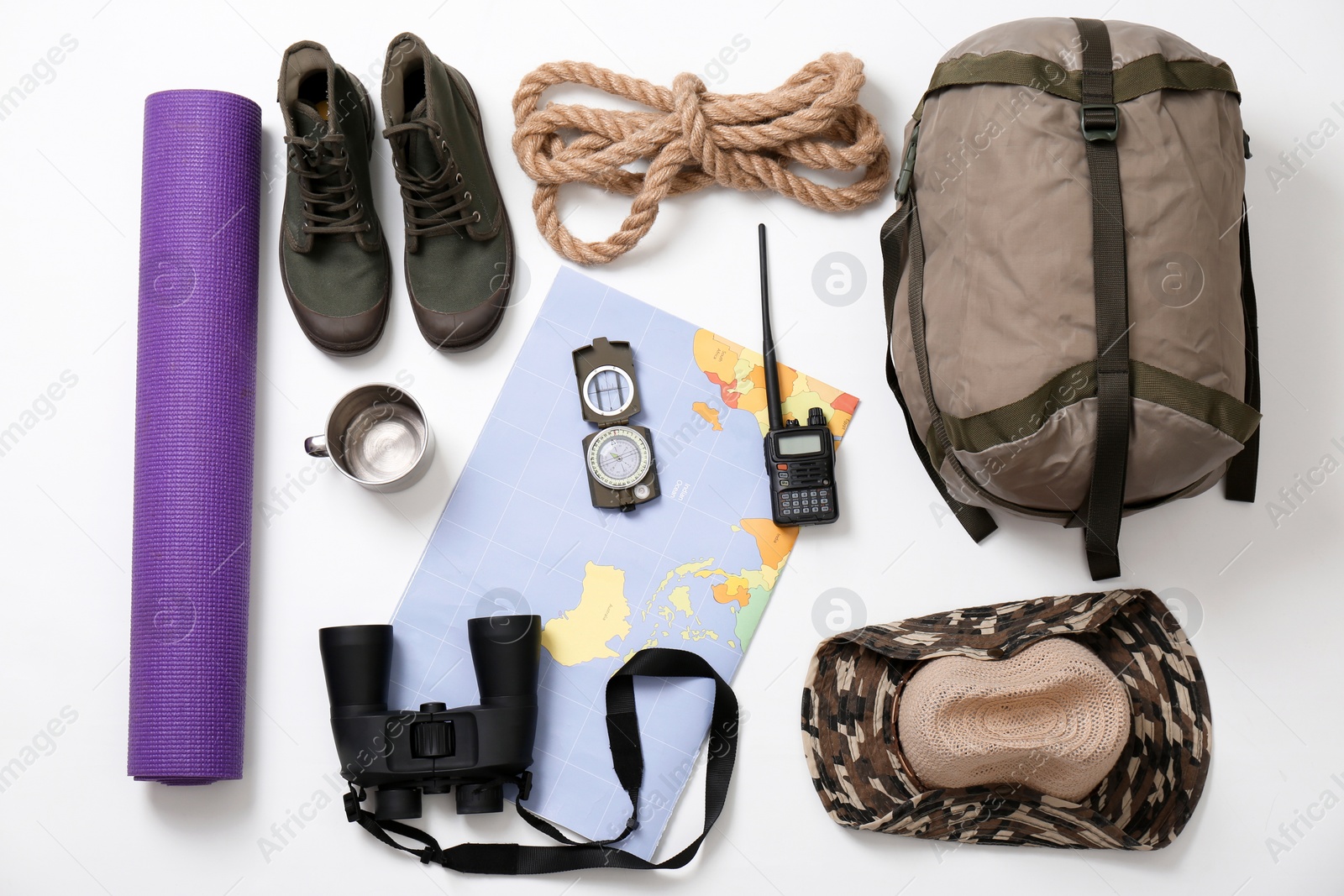 Photo of Flat lay composition with camping equipment on white background