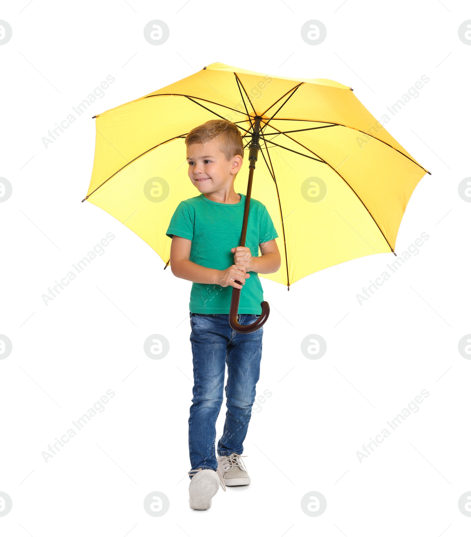 Photo of Little boy with yellow umbrella on white background