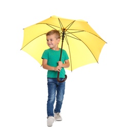 Photo of Little boy with yellow umbrella on white background