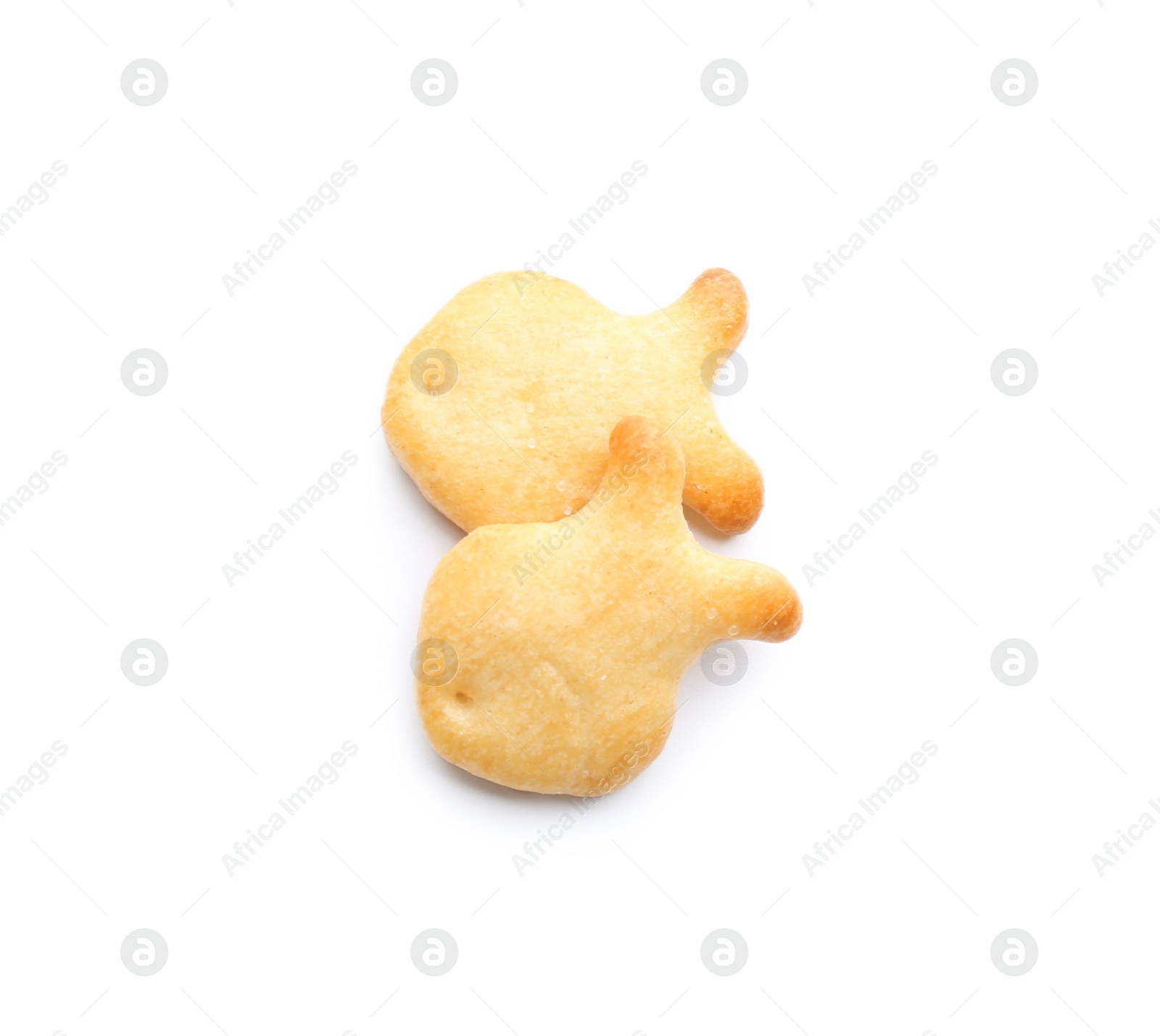 Photo of Delicious crispy goldfish crackers on white background, top view