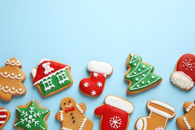 Photo of Flat lay composition with tasty homemade Christmas cookies on light blue background, space for text