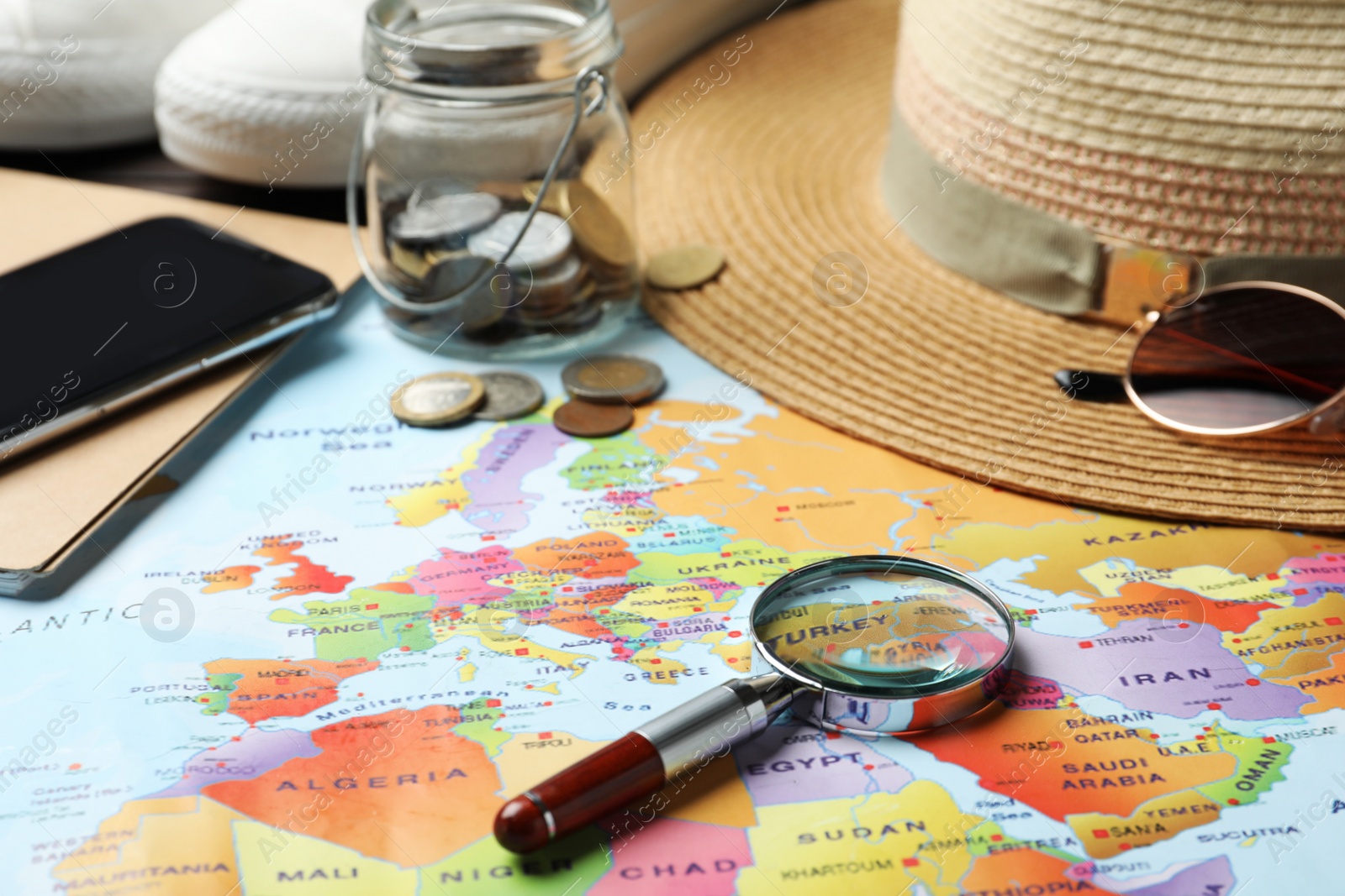 Photo of Different items on world map. Travel during summer vacation