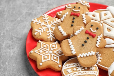 Tasty homemade Christmas cookies on grey table