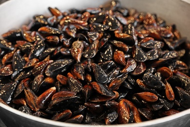 Photo of Many delicious fresh mussels in pan, closeup